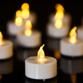 100 Pack Flameless LED Tea Lights Candles Flickering Warm Yellow 200+ Hours