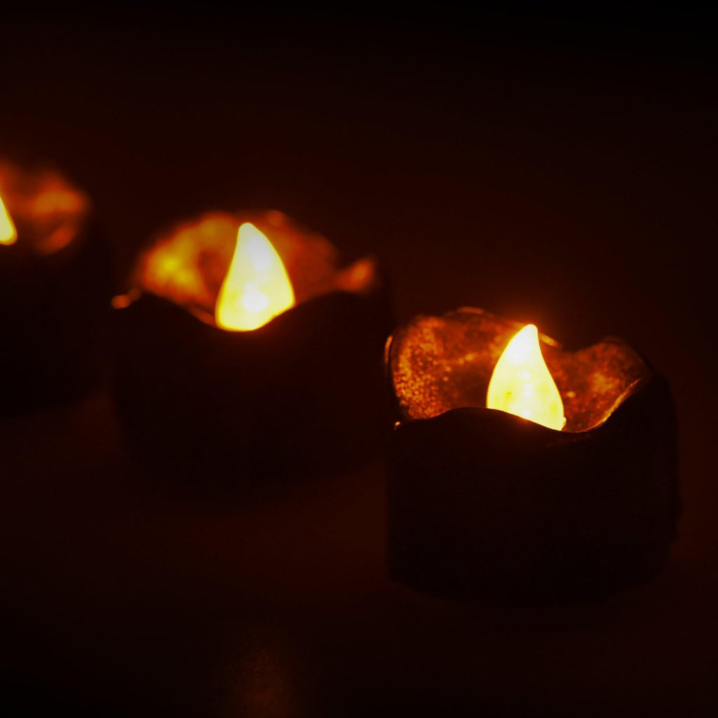 eLander Halloween Decorations Candles Tea Lights, Battery Operated, Flickering Flameless [12 Pack ¨C Amber Yellow]