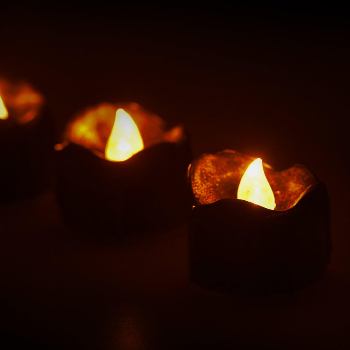 eLander Halloween Decorations Candles Tea Lights, Battery Operated, Flickering Flameless [12 Pack ¨C Amber Yellow]
