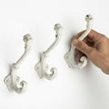 The Metal Magician Wall Mounted Antique Cast Iron Vintage Style Wall Hooks for Coats, Bags, Towels, Hats - (Set of 3) Distressed White