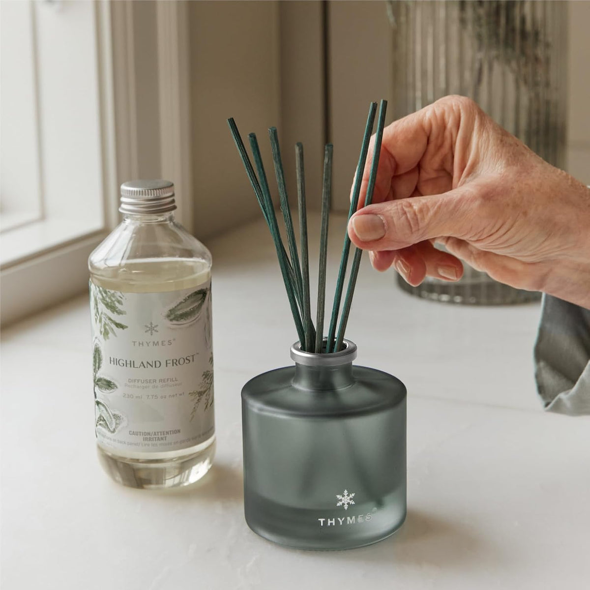 Thymes Petite Oil Reed Diffuser Set – Includes Reed Diffuser Sticks, Fragrance Oil, & Glass Bottle – Luxury Home Decor – Holiday Decor – Winter Scents – Sage-Green (Highland Frost, 4 fl oz)
