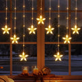 Marchpower 9 Stars Curtain Lights Warm White, IP65 Battery Operated Christmas Star Window Curtains with Timer & Memory Function, 76 LED String Lights with 8 Modes and 10 Hooks for Xmas Decor