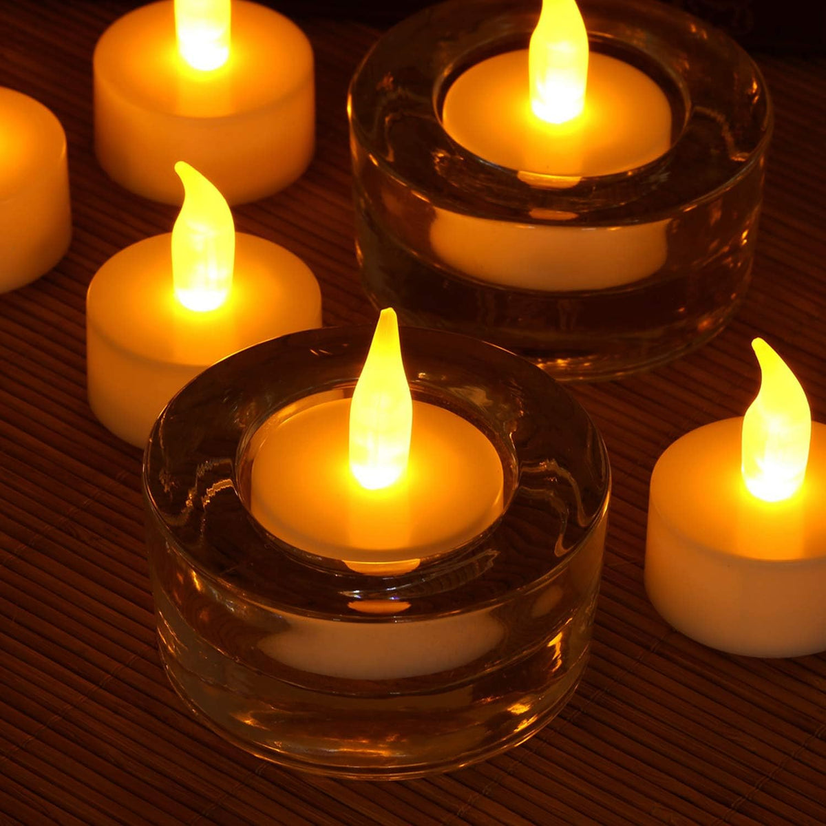 Novelty Place Pack of 12 Flameless LED Tea Light Candles - Warm Yellow Flickering Bright Tealights for Votive, Wedding, and Birthday - Battery-Powered Electric Candles